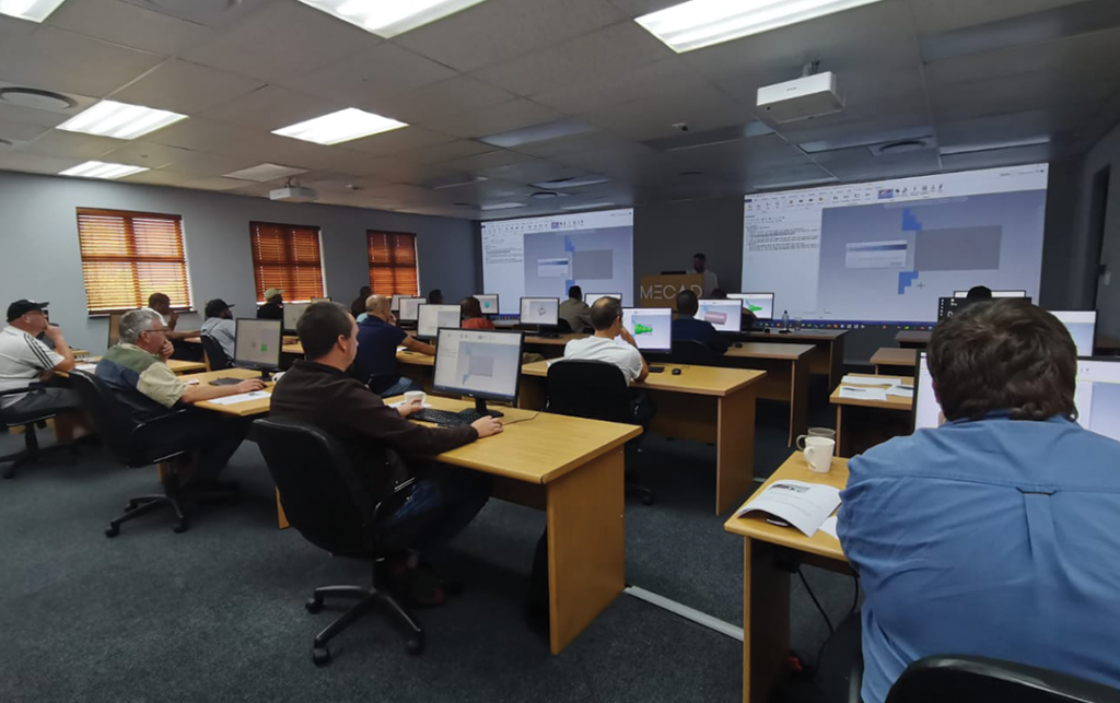 An image of MECAD Systems training room filled with trainees.